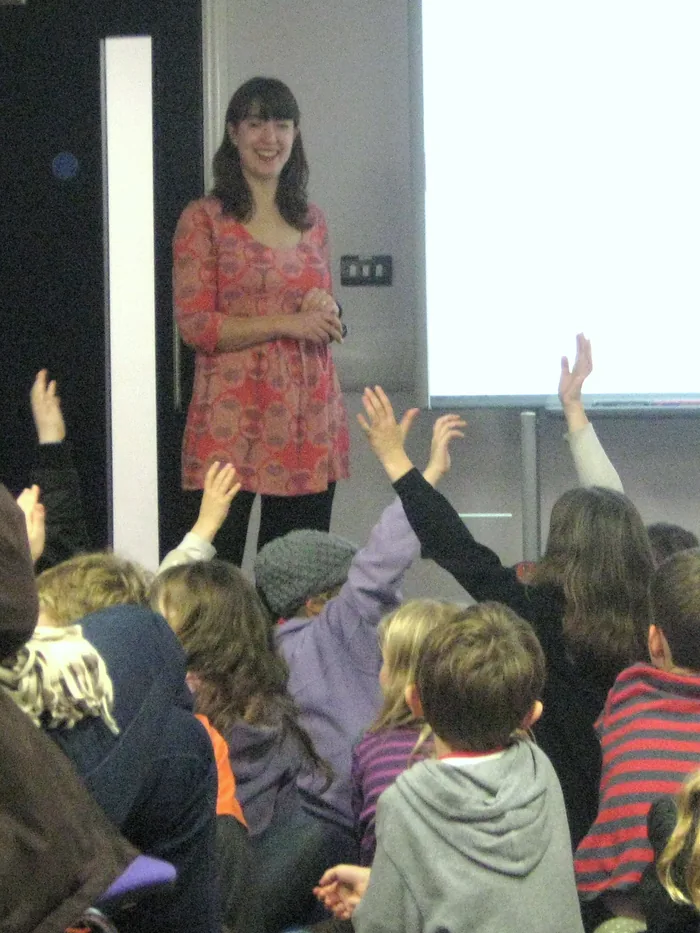 Emma Barnes meeting young readers at a school event